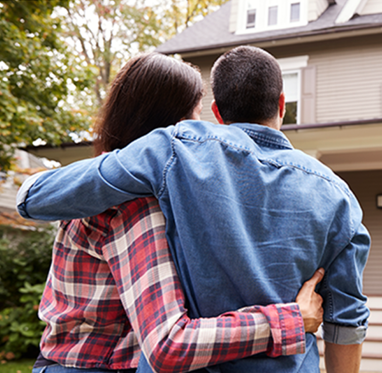Family in front of home